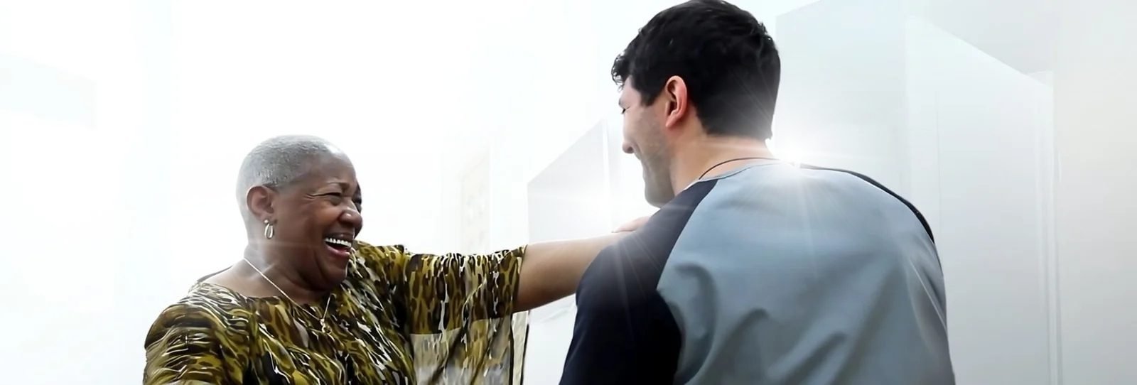 Dr. Theo Kousouli working with a female client performing Kousouli Neural Emotive reprogramming, a part of the Kousouli Method of Healing System