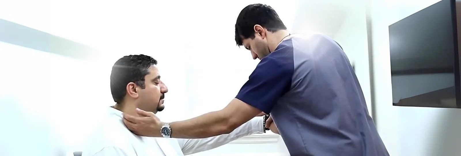 Dr. Theo Kousouli working with a male client performing Kousouli Neural Emotive reprogramming, a part of the Kousouli Method of Healing System