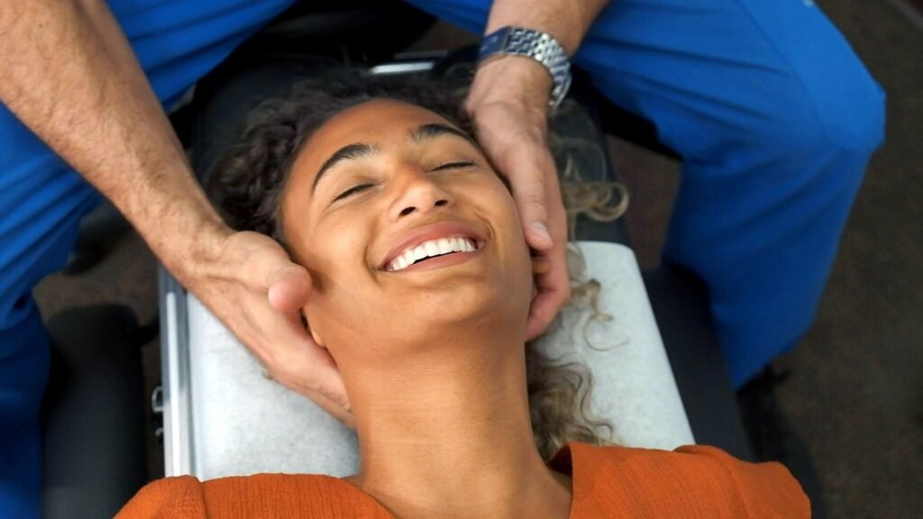 Client receiving chiropractic care for neck back pain, hypnotherapy, and holistic wellness treatment with Dr. Theo Kousouli in Mount Kisco, NY