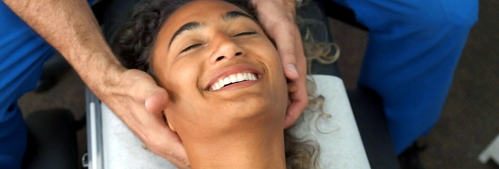 Dr. Theo Kousouli performing spinal adjustments for back and neck pain