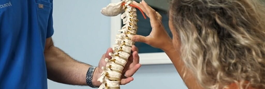 Dr. Theo Kousouli providing chiropractic care for neck and back healing